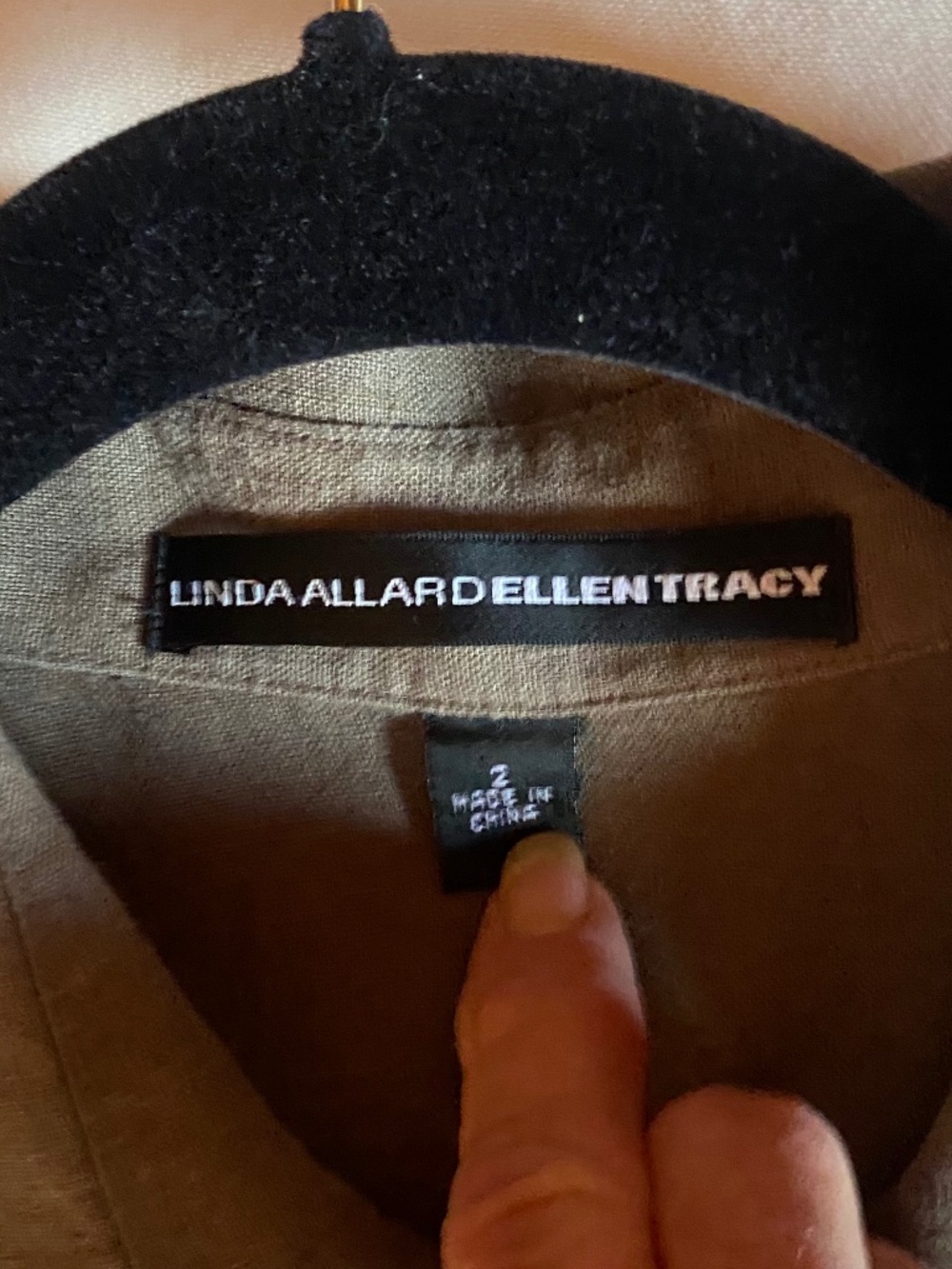 Linen full button layering overtop size small/2 full cut in the color olive.